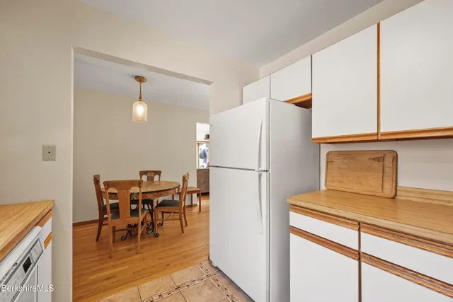 a white refrigerator freezer sitting in a kitchen