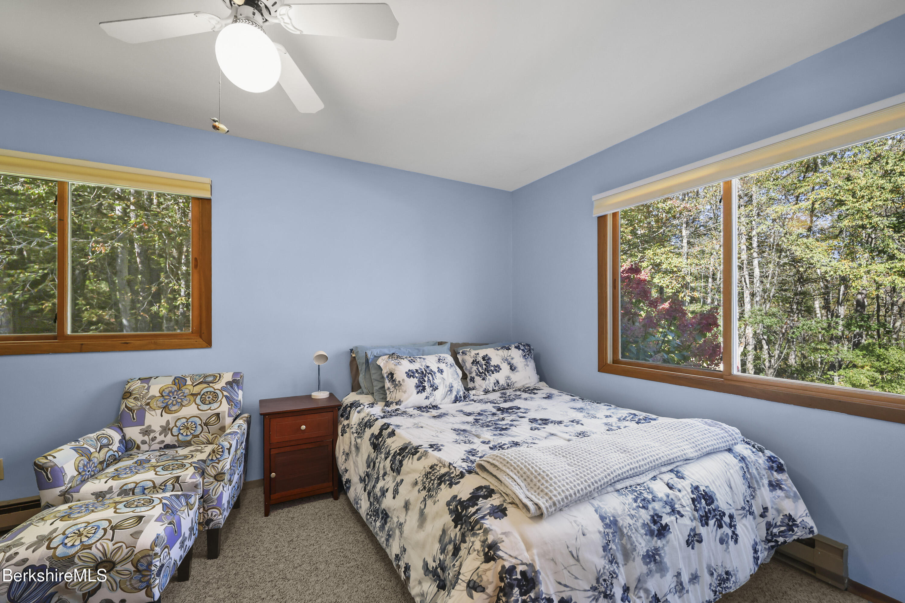 337 Captain Whitney Road Becket, MA 01223 - Photo 22 of 53 a bedroom with a bed and a window