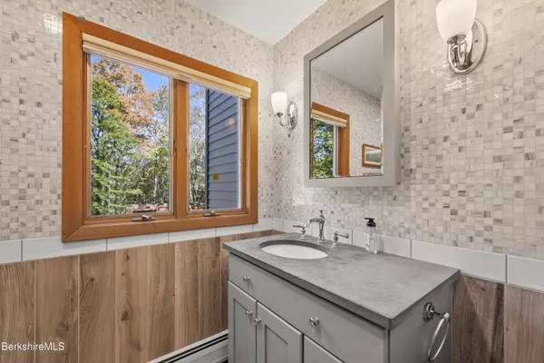 a bathroom with a toilet a sink and bathtub