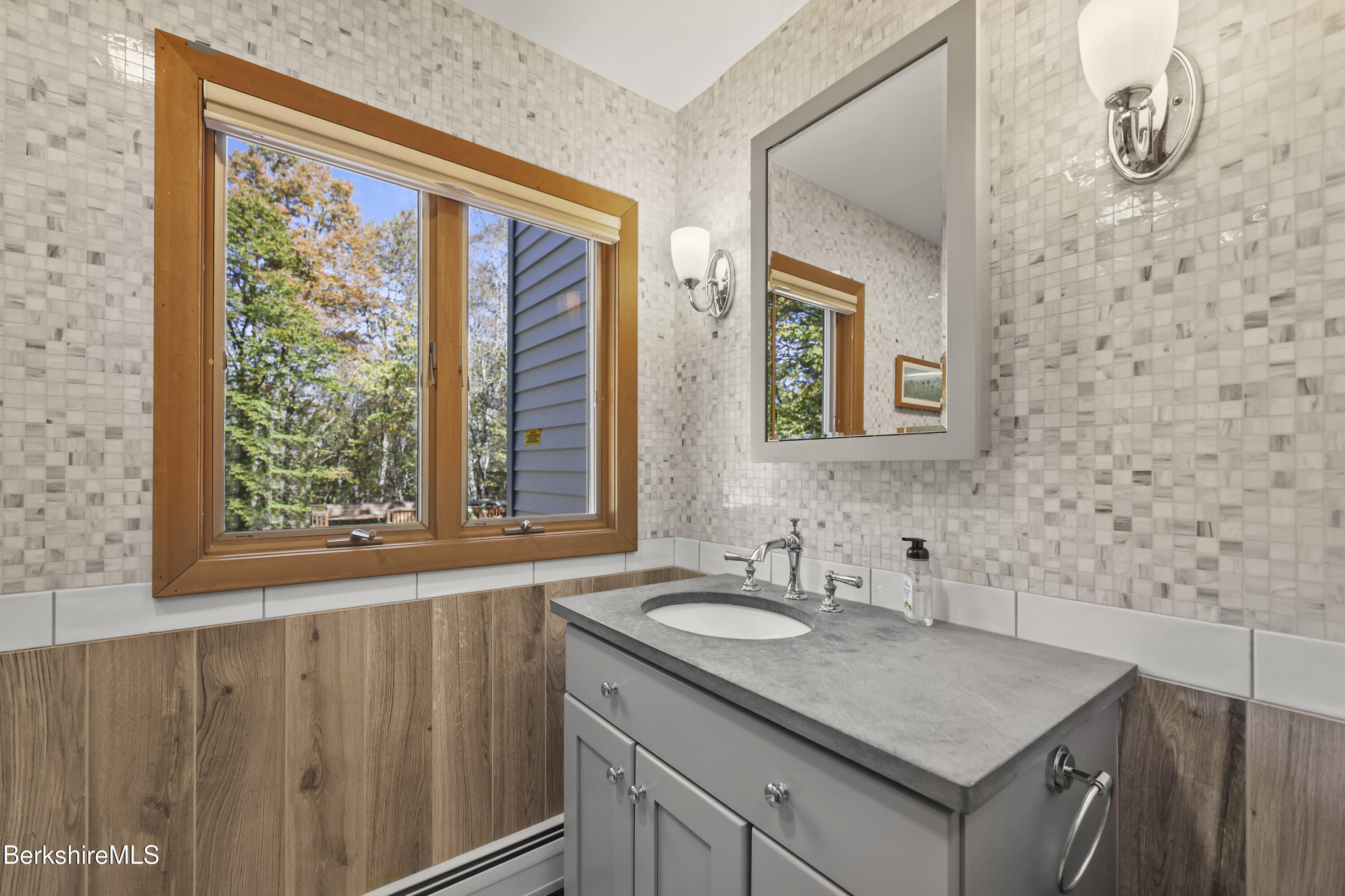 337 Captain Whitney Road Becket, MA 01223 - Photo 25 of 53 a bathroom with a granite countertop sink and a window