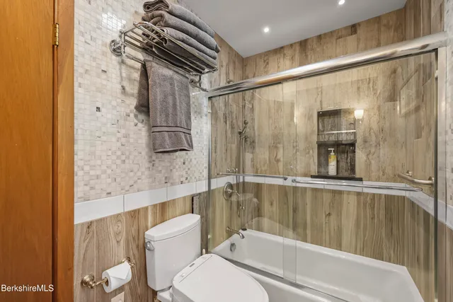 a view of a workspace with furniture and a ceiling fan