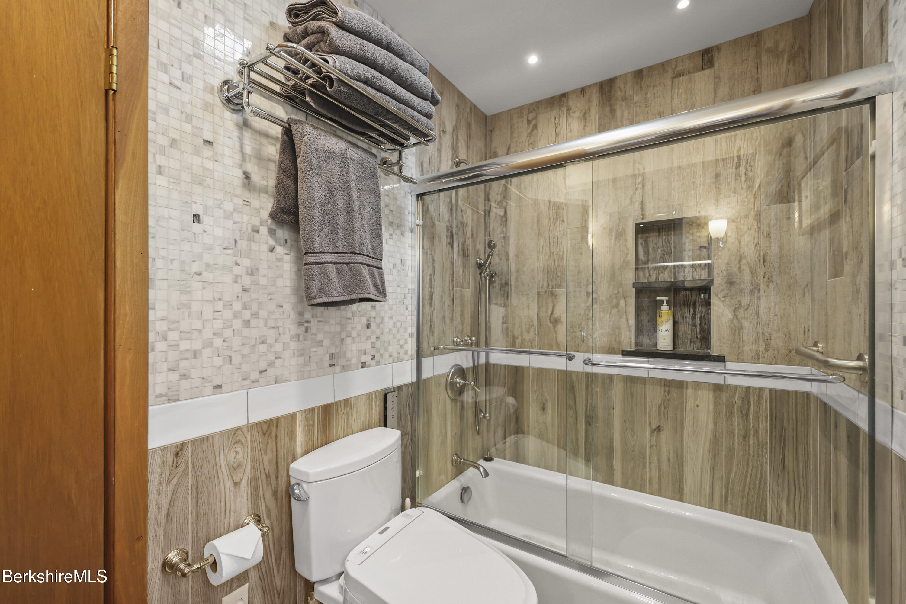 337 Captain Whitney Road Becket, MA 01223 - Photo 26 of 53 a bathroom with a toilet a sink and bathtub