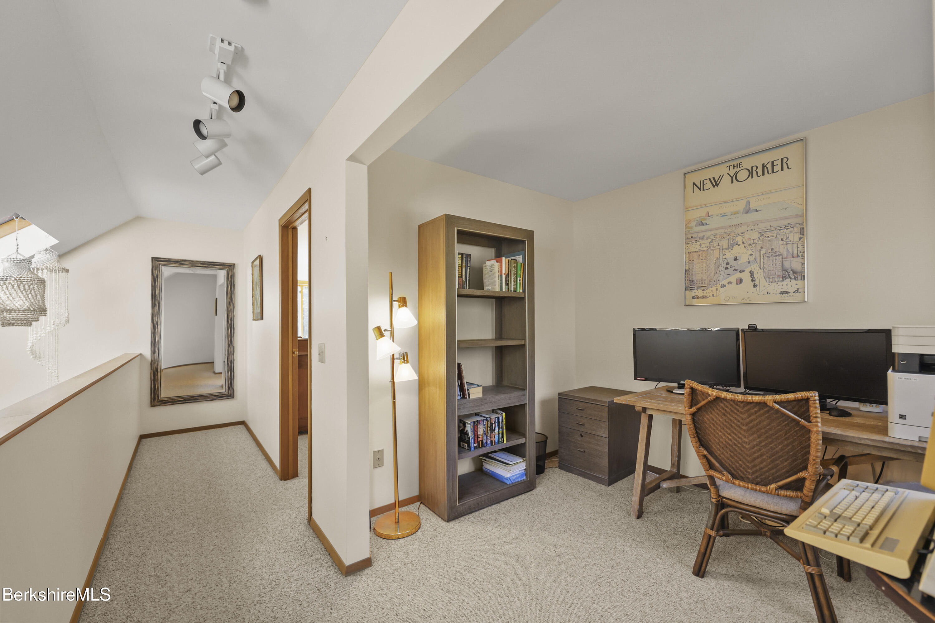 337 Captain Whitney Road Becket, MA 01223 - Photo 27 of 53 a view of a workspace with furniture and a ceiling fan