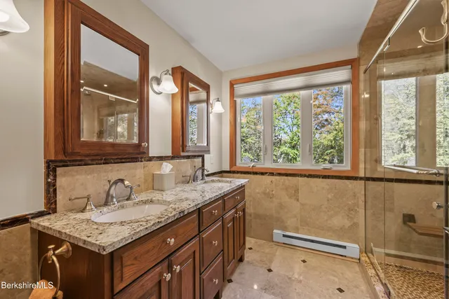 a living room with furniture a large window and table
