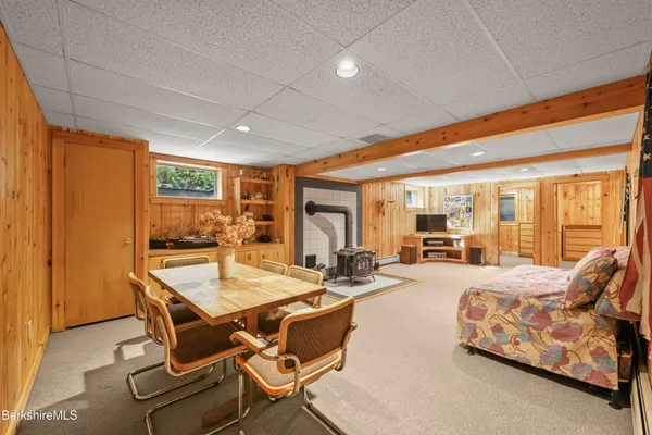 a room with furniture and flat screen tv