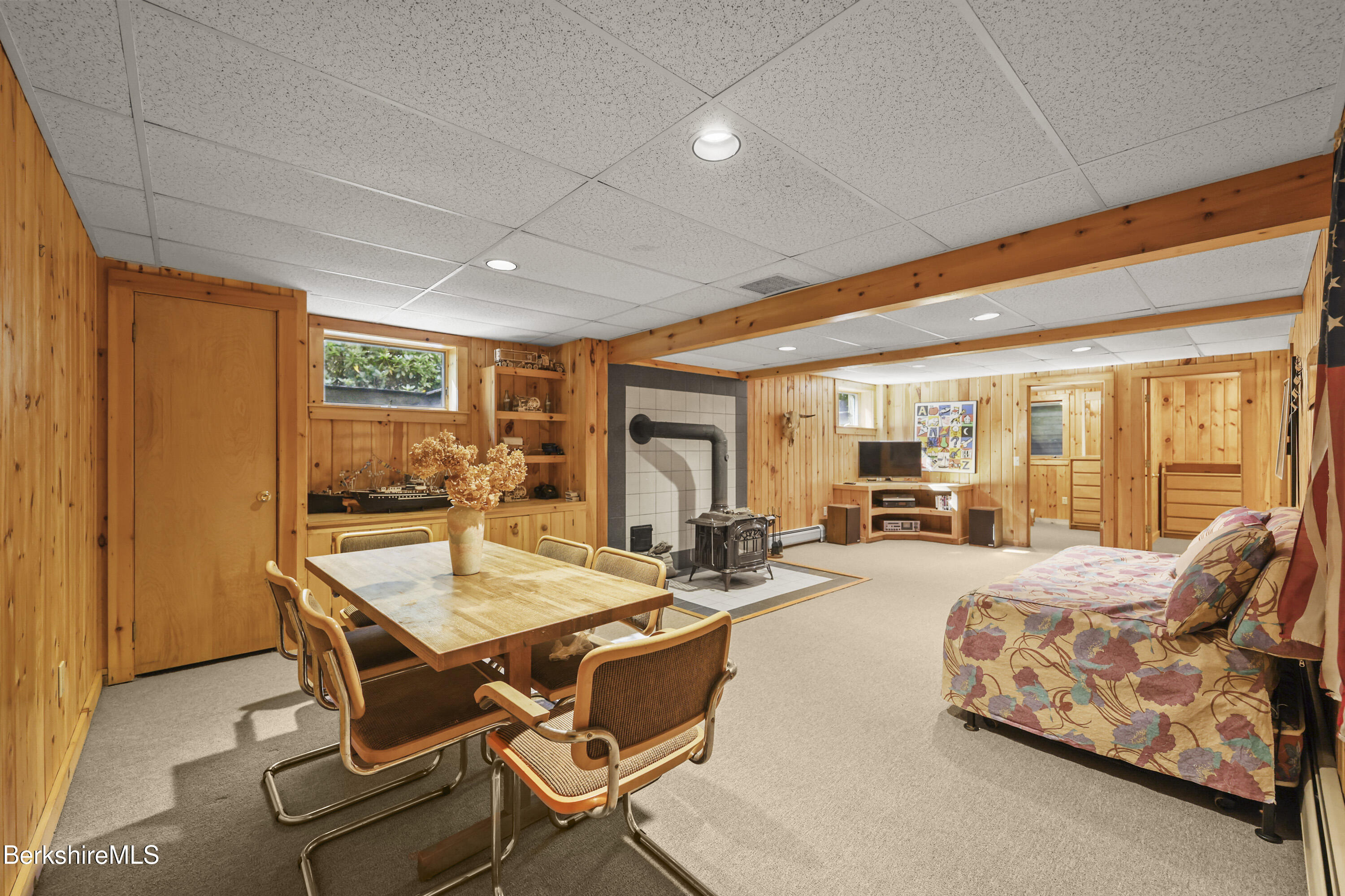 337 Captain Whitney Road Becket, MA 01223 - Photo 34 of 53 a living room with furniture a large window and table
