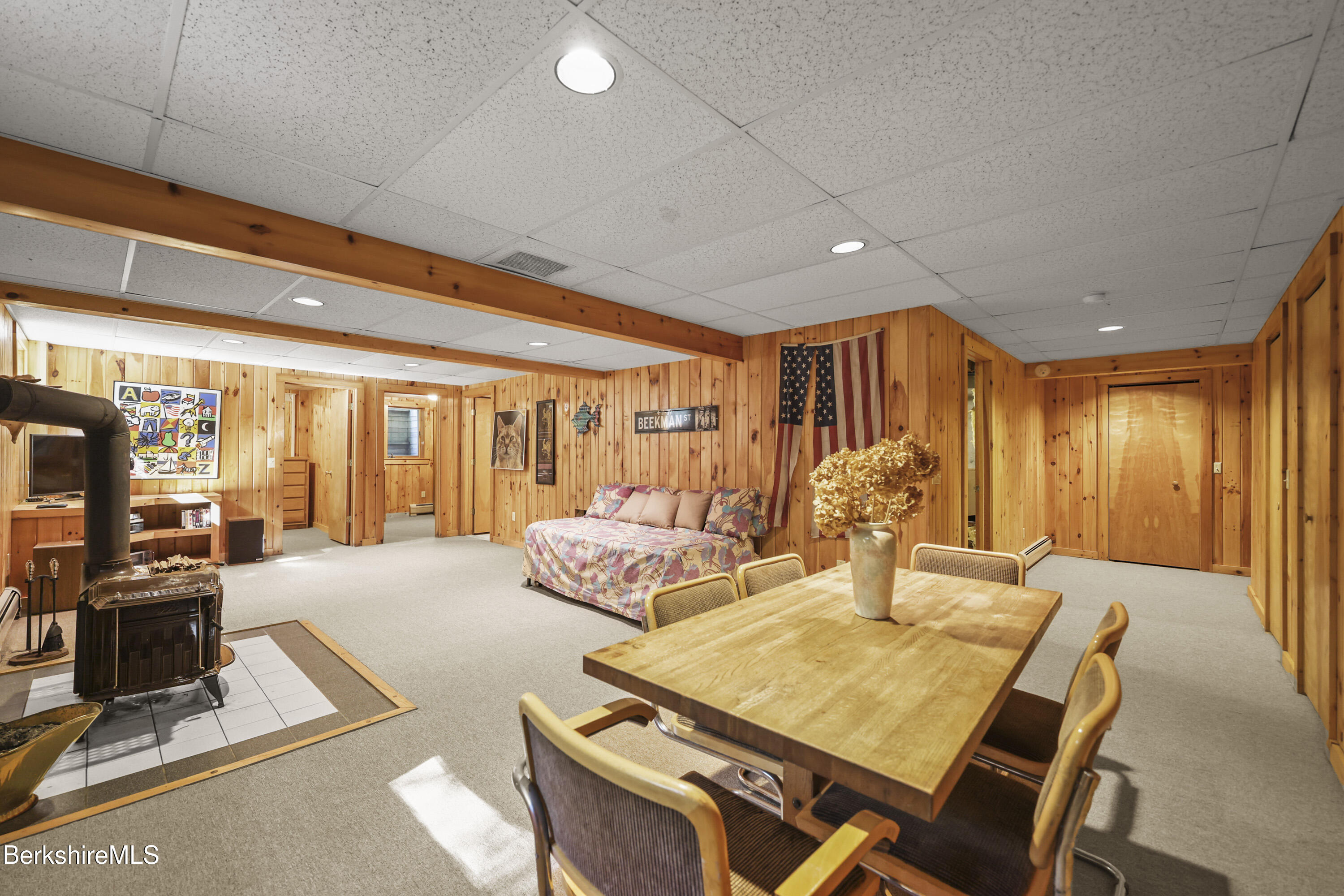 337 Captain Whitney Road Becket, MA 01223 - Photo 35 of 53 a living room with furniture a large window and chandelier