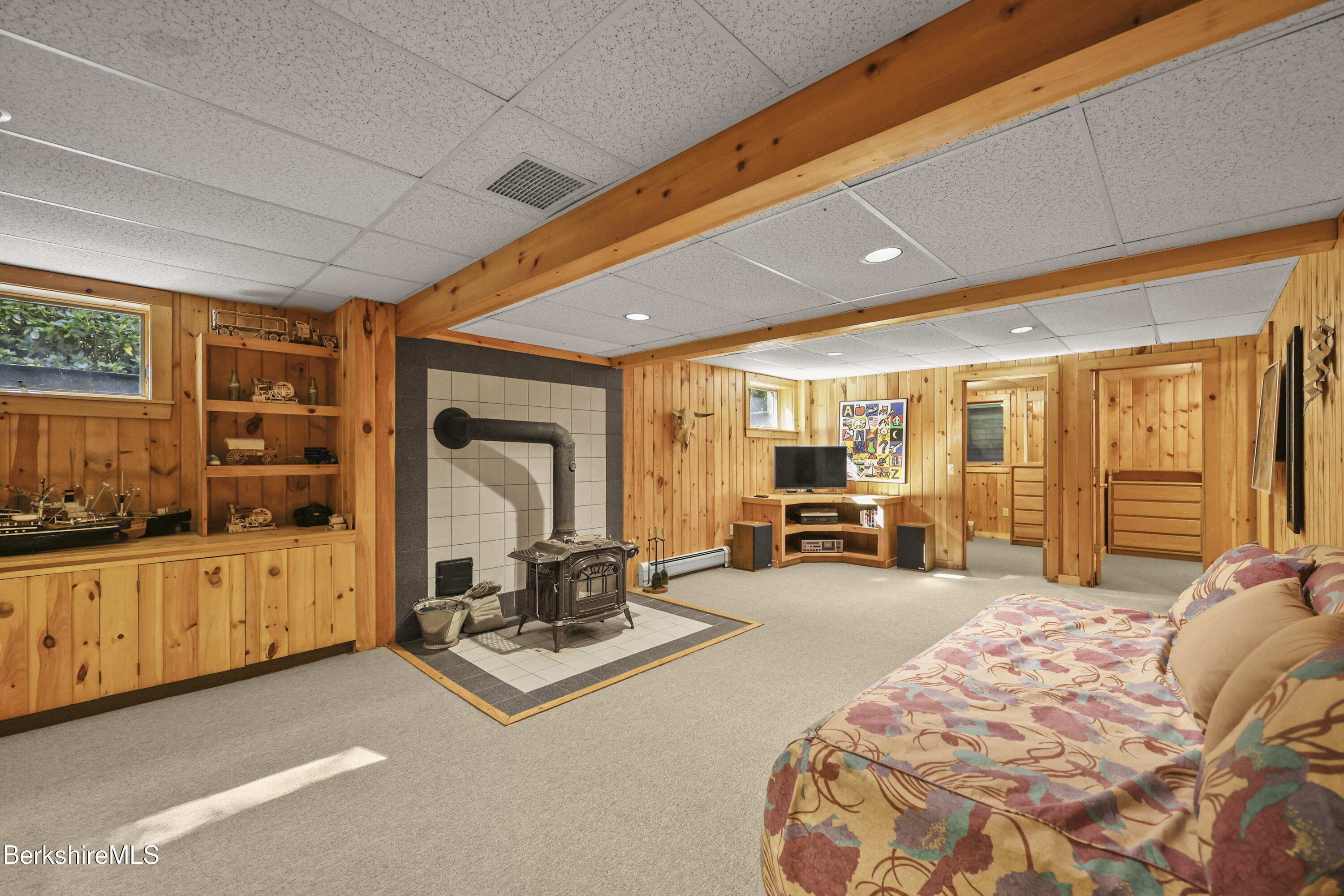 337 Captain Whitney Road Becket, MA 01223 - Photo 36 of 53 a room with furniture and flat screen tv