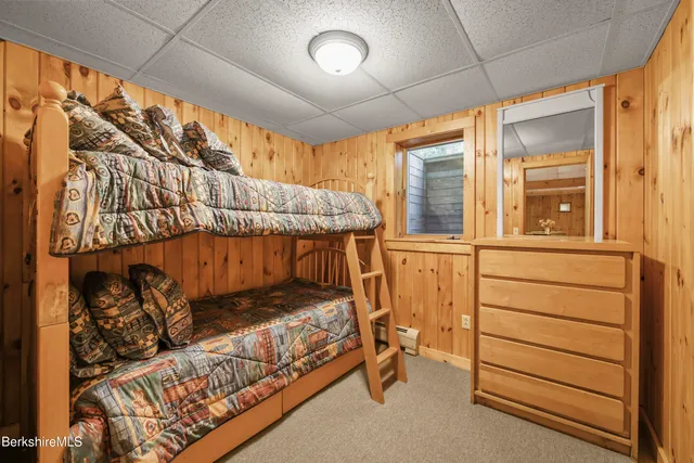 a utility room with lots of wooden furniture