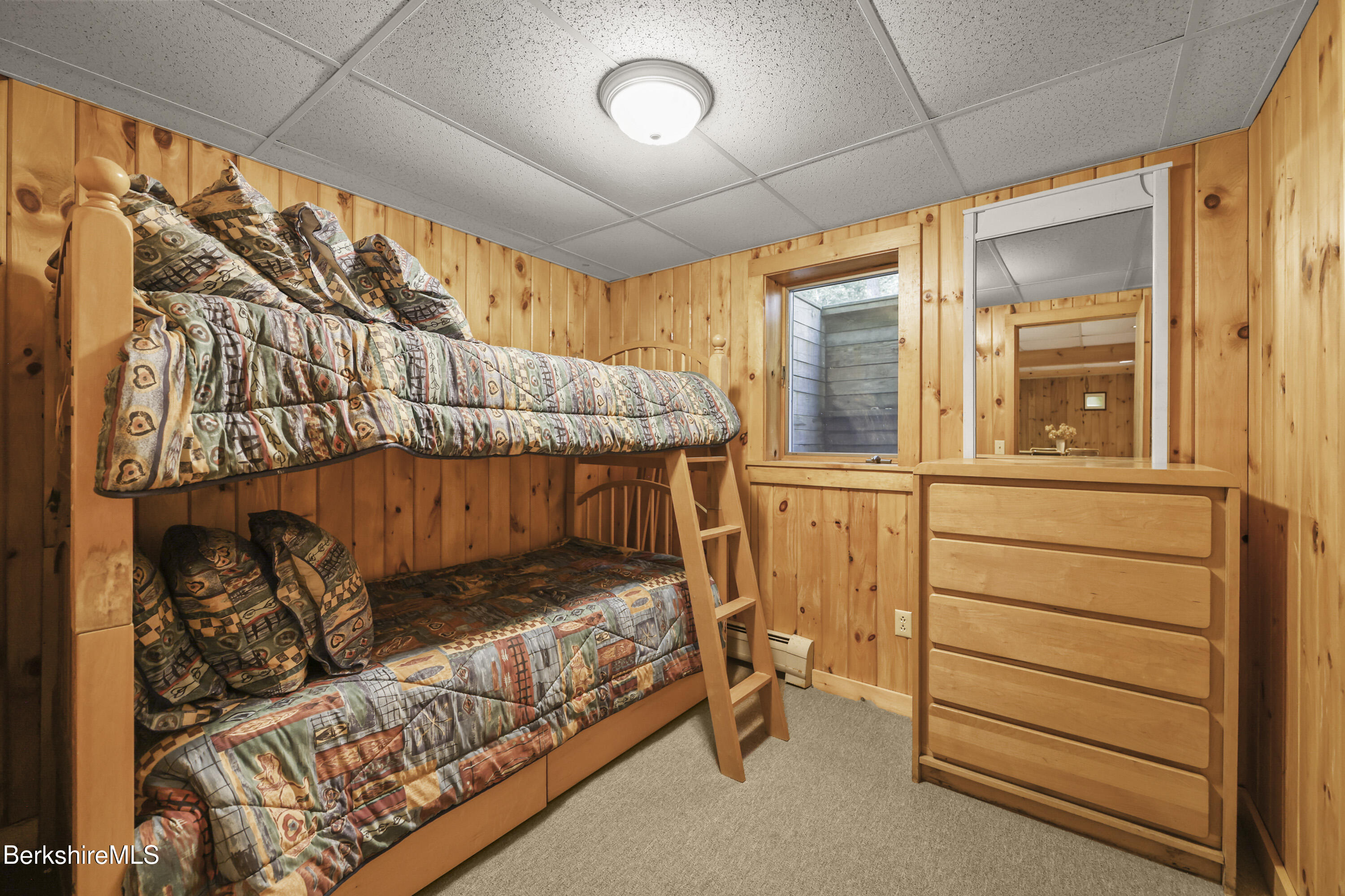 337 Captain Whitney Road Becket, MA 01223 - Photo 39 of 53 a bedroom with a bed and a window