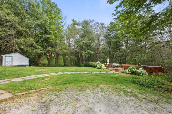 a view of a deck with two chairs and a table