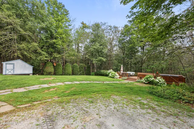 a view of a deck with two chairs and a table