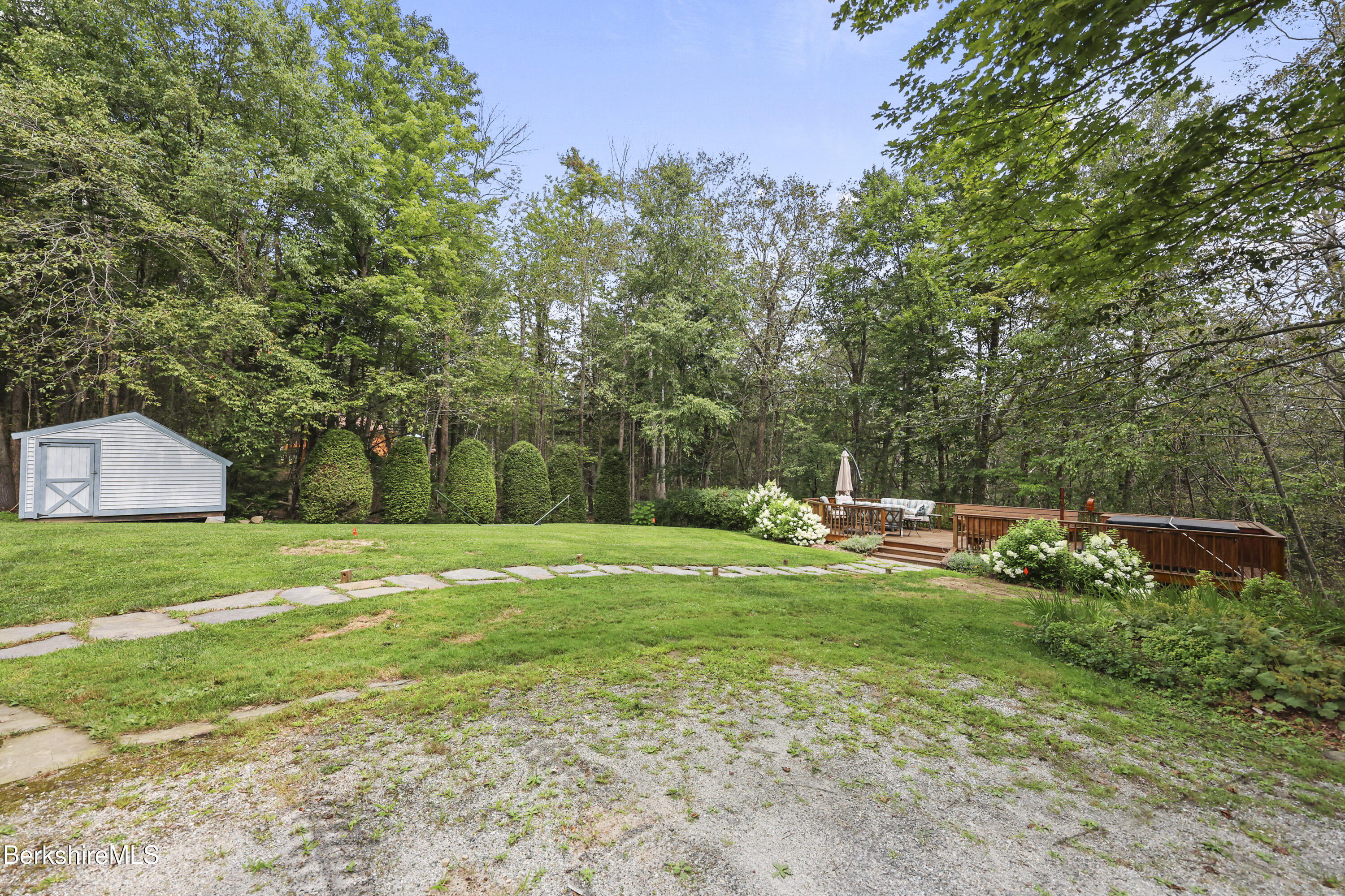 337 Captain Whitney Road Becket, MA 01223 - Photo 45 of 53 a view of a house with a yard and sitting area