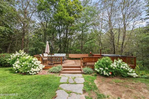 a view of a patio with two chairs and a table