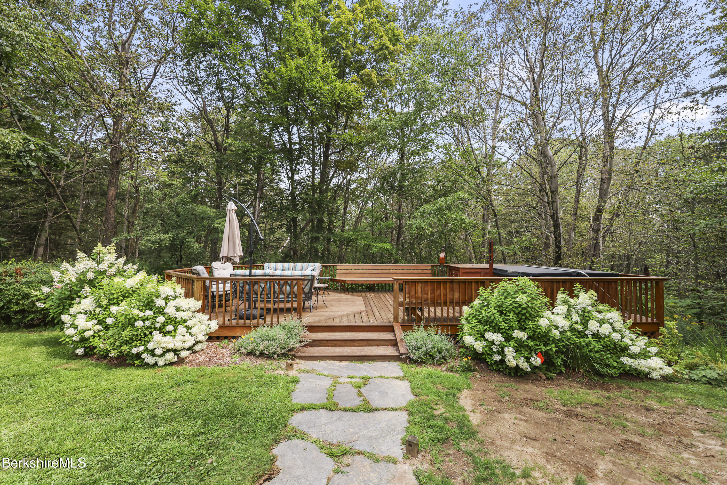 337 Captain Whitney Road Becket, MA 01223 - Photo 46 of 53 a view of backyard with seating area and green space