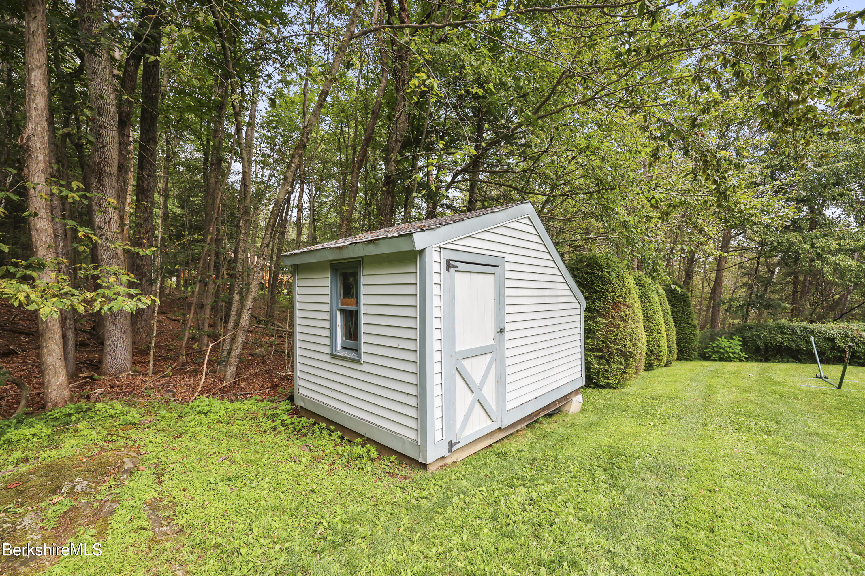 337 Captain Whitney Road Becket, MA 01223 - Photo 51 of 53 a view of a house with a yard