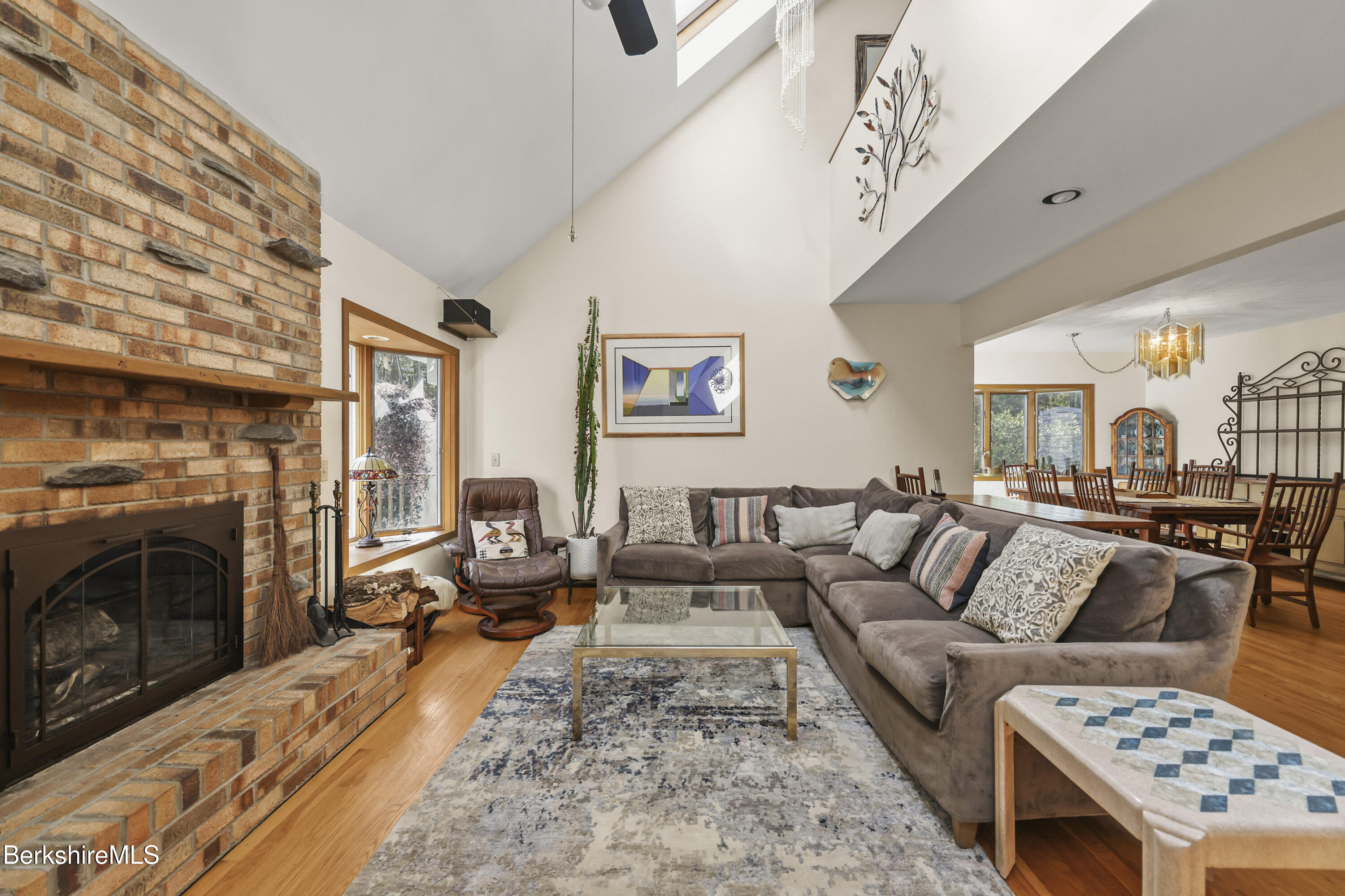 337 Captain Whitney Road Becket, MA 01223 - Photo 7 of 53 a living room with furniture and a fireplace