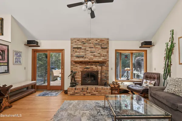 a living room with furniture windows and a fireplace