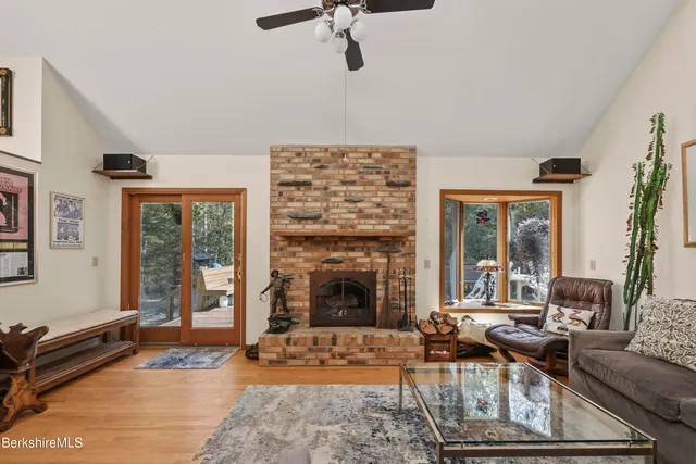 a living room with furniture windows and a fireplace