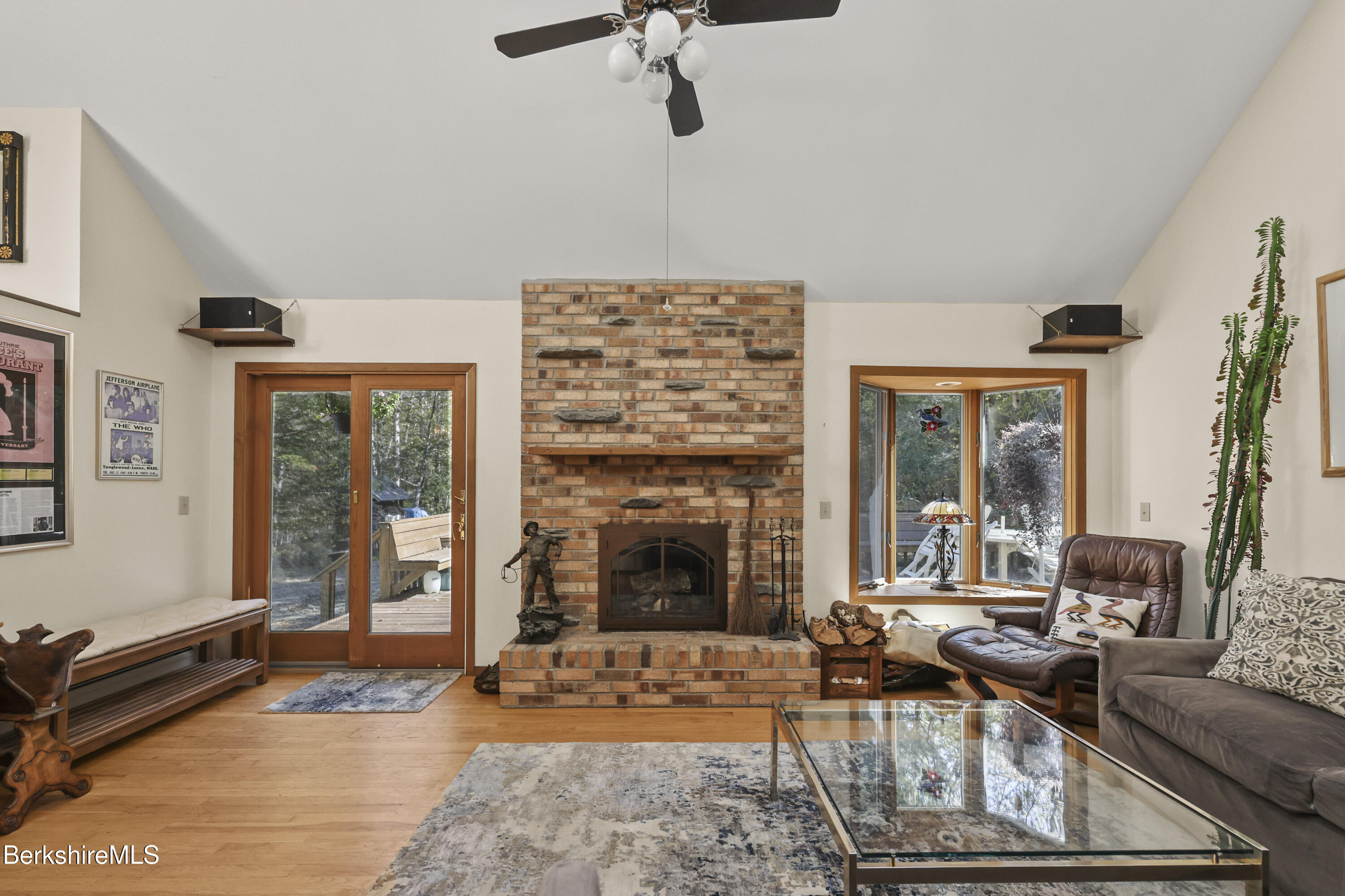 337 Captain Whitney Road Becket, MA 01223 - Photo 10 of 53 a living room with furniture windows and a fireplace