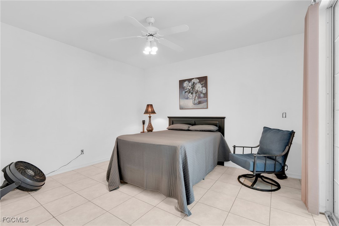 809 Hamilton Avenue Lehigh Acres, FL 33972 - Photo 12 of 25 a living room with furniture and a chair