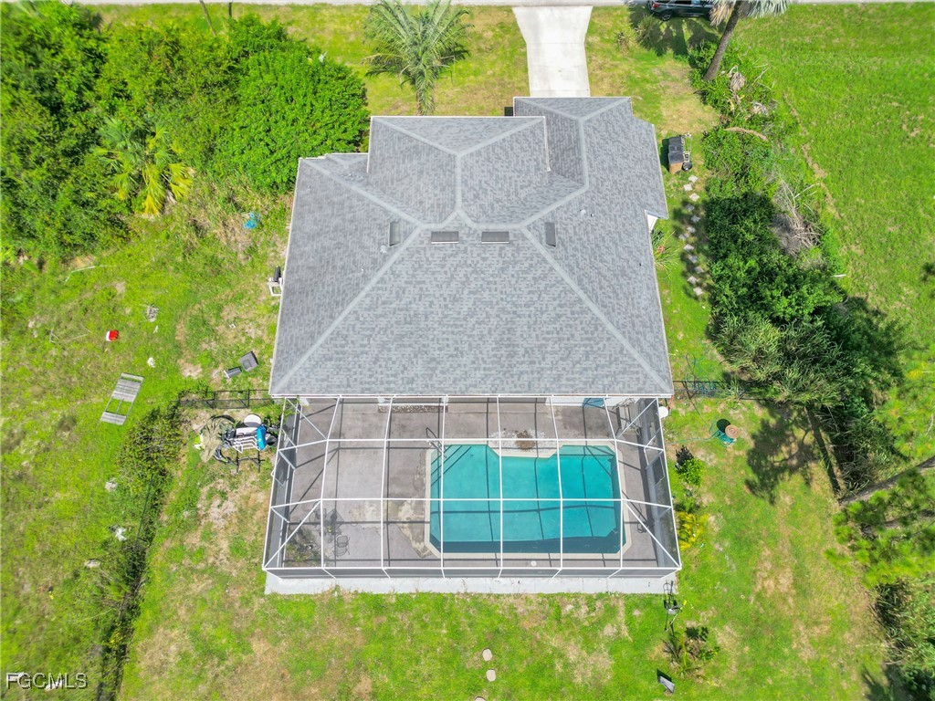 809 Hamilton Avenue Lehigh Acres, FL 33972 - Photo 18 of 25 an aerial view of a house with a yard and large tree