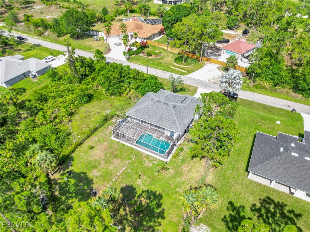 809 Hamilton Avenue Lehigh Acres, FL 33972 - Photo 21 of 25 an aerial view of a house with a yard