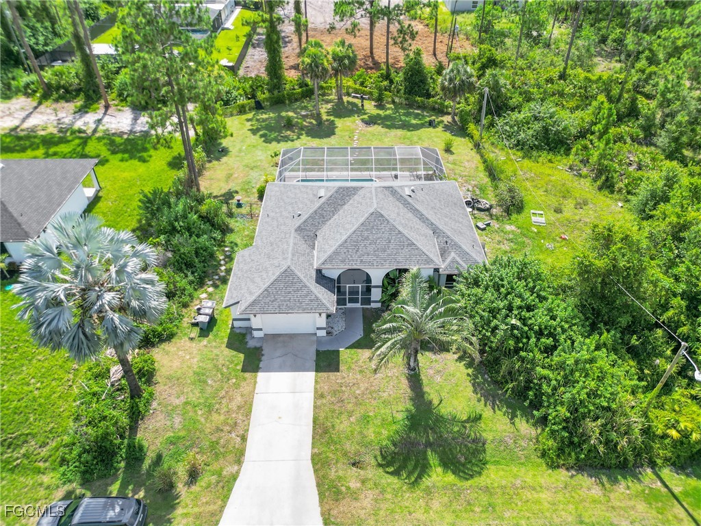 809 Hamilton Avenue Lehigh Acres, FL 33972 - Photo 5 of 25 a view of a yard with plants