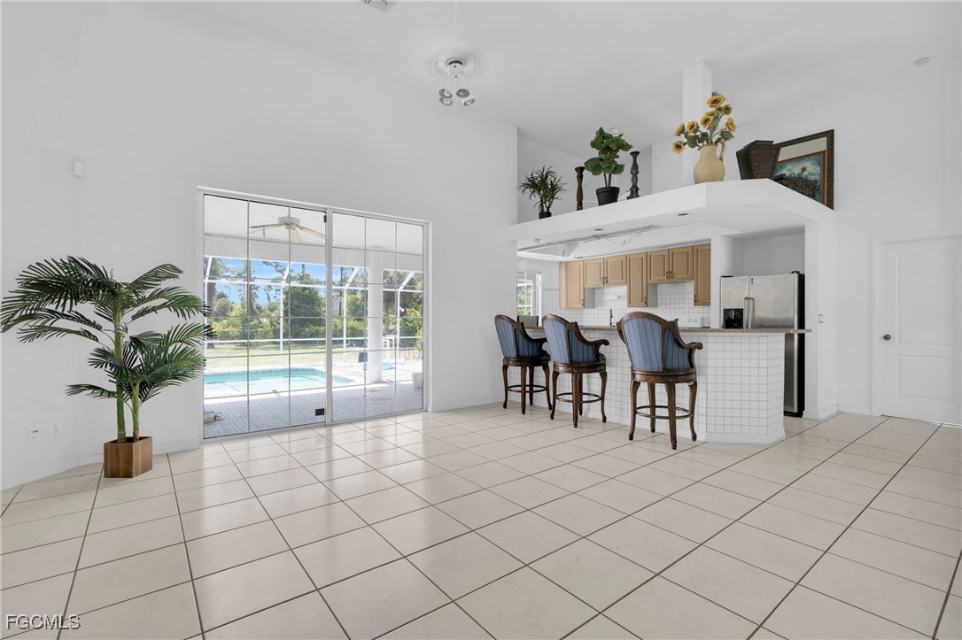 809 Hamilton Avenue Lehigh Acres, FL 33972 - Photo 9 of 25 a view of a dining room with furniture