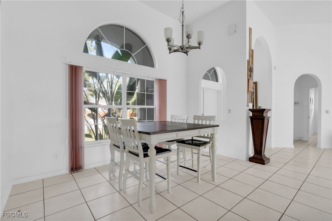 809 Hamilton Avenue Lehigh Acres, FL 33972 - Photo 10 of 25 a view of a dining room with furniture and window