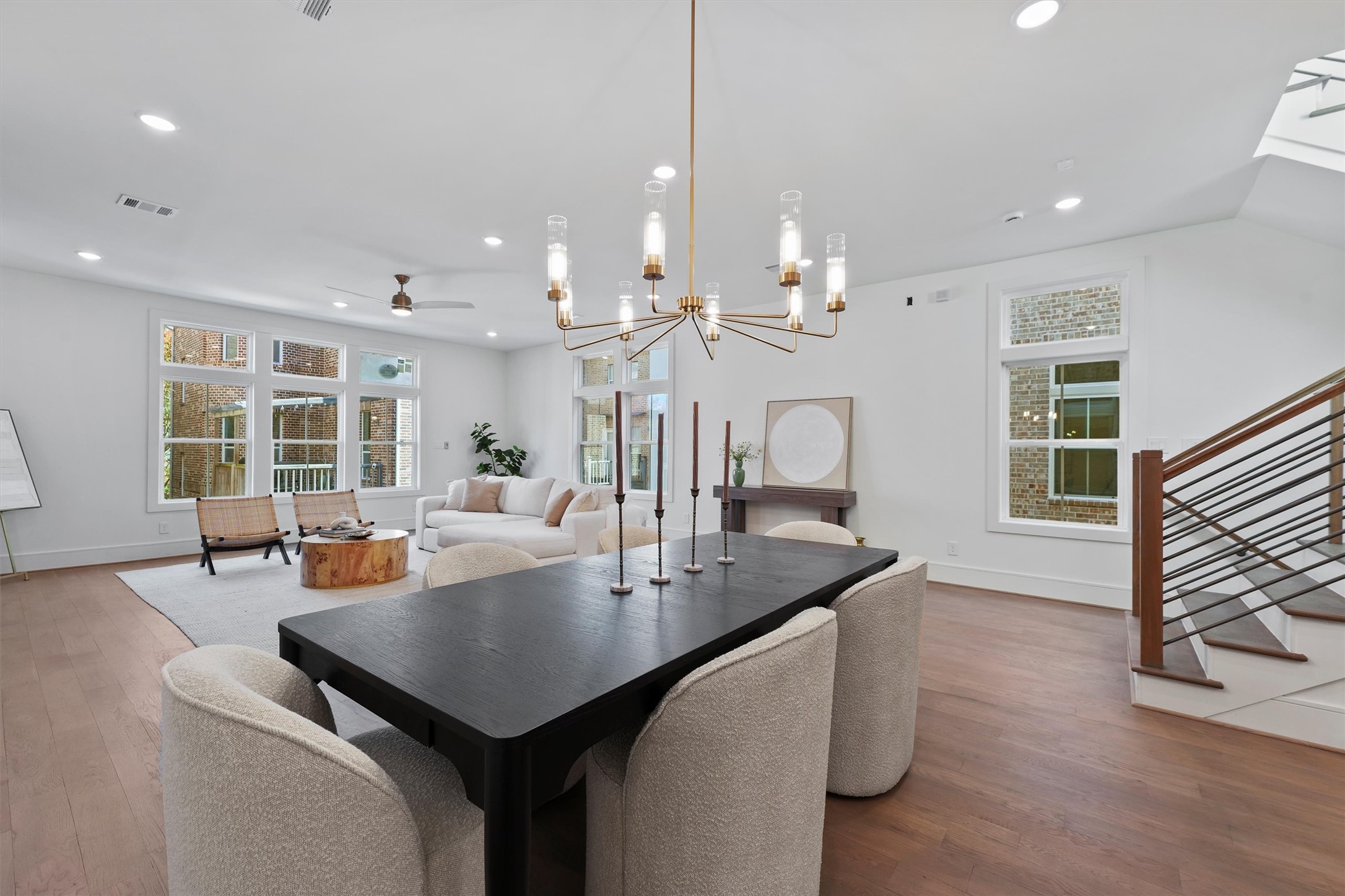5407 Dickson Street Houston, TX 77007 - Photo 13 of 31 a living room with dining table chairs and wooden floor