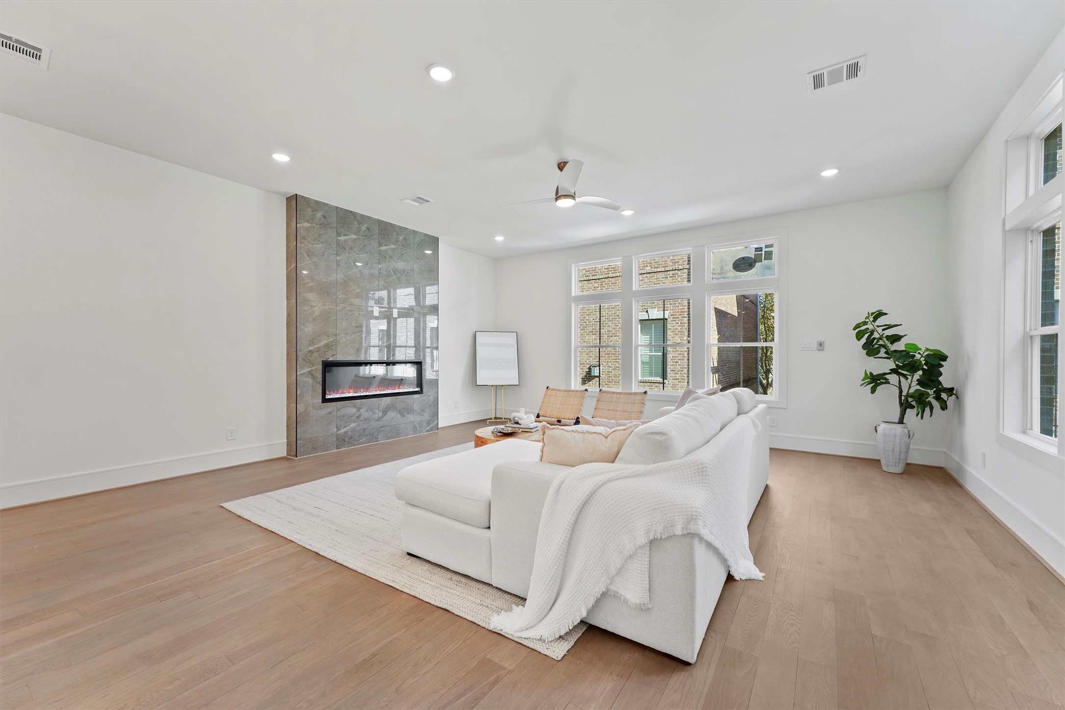 5407 Dickson Street Houston, TX 77007 - Photo 15 of 31 a spacious bedroom with a large bed and a potted plant