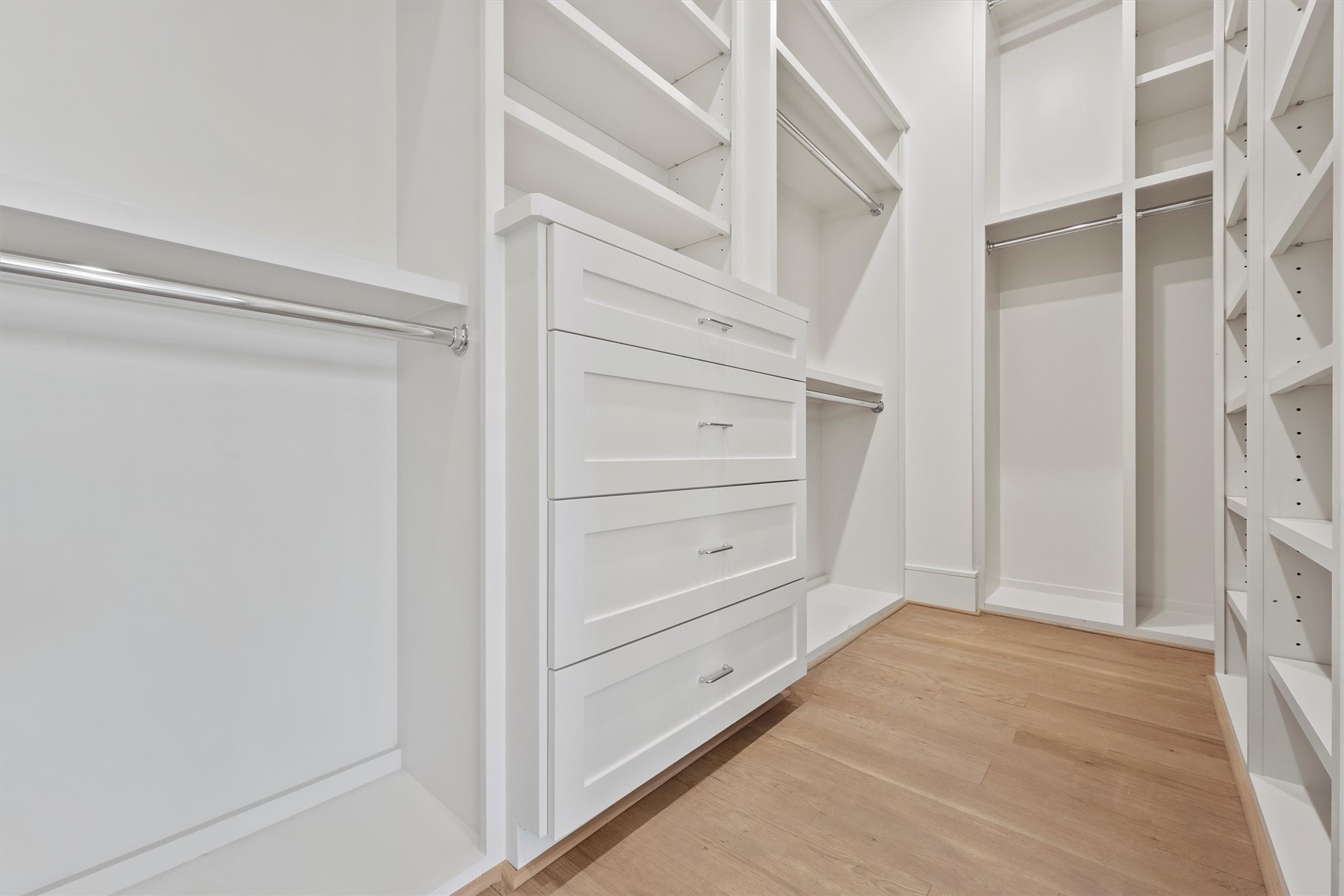 5407 Dickson Street Houston, TX 77007 - Photo 23 of 31 a view of walk in closet with empty racks