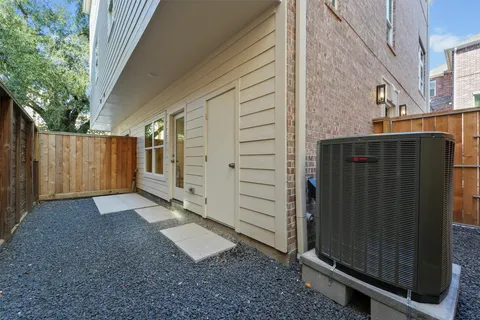 a view of a house with backyard and wooden fence