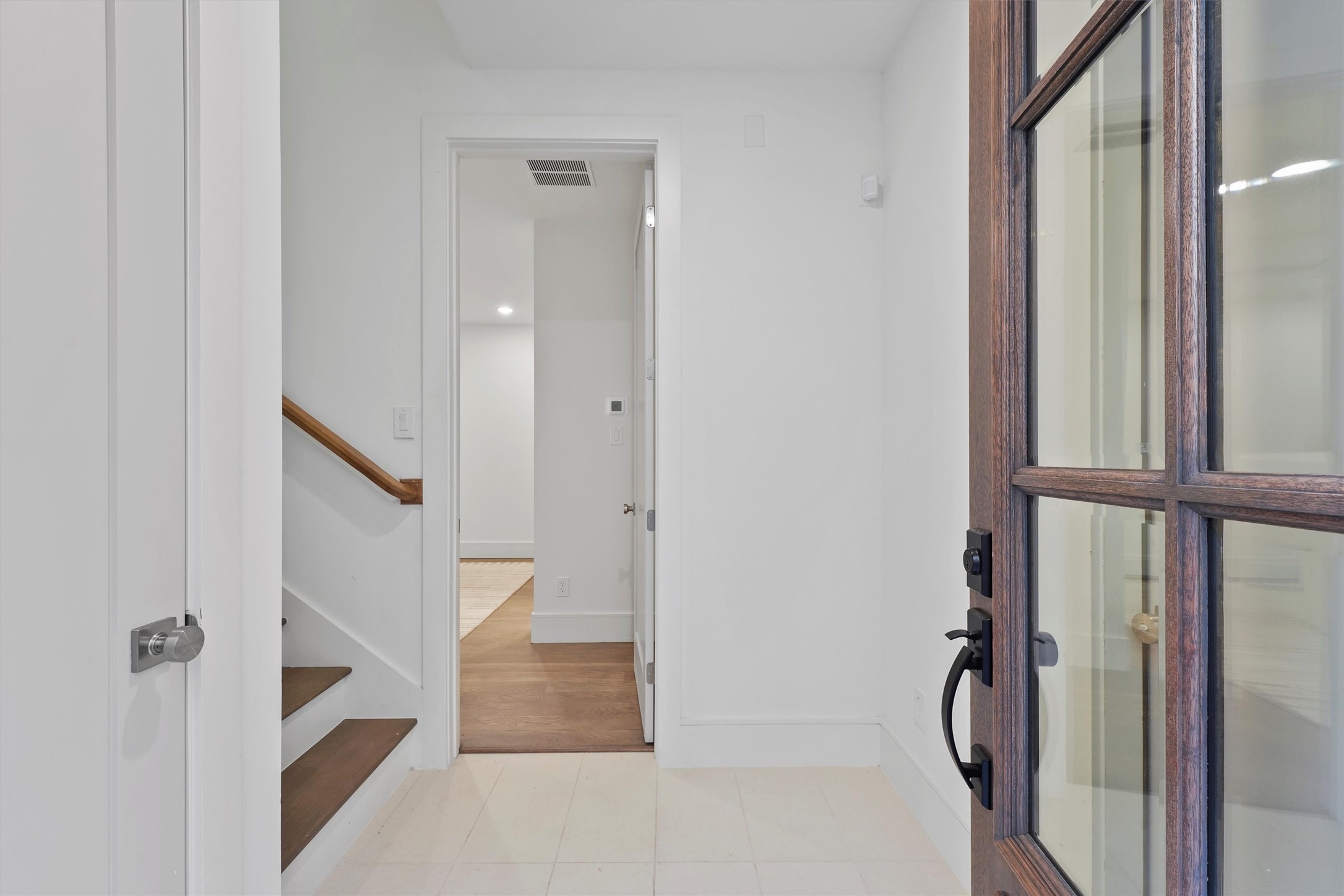 5407 Dickson Street Houston, TX 77007 - Photo 5 of 31 a view of staircase with white walls and door