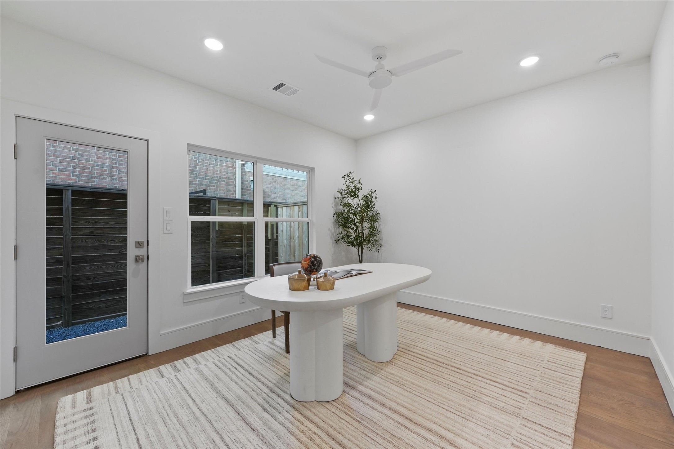 5407 Dickson Street Houston, TX 77007 - Photo 6 of 31 a dining room with furniture and wooden floor