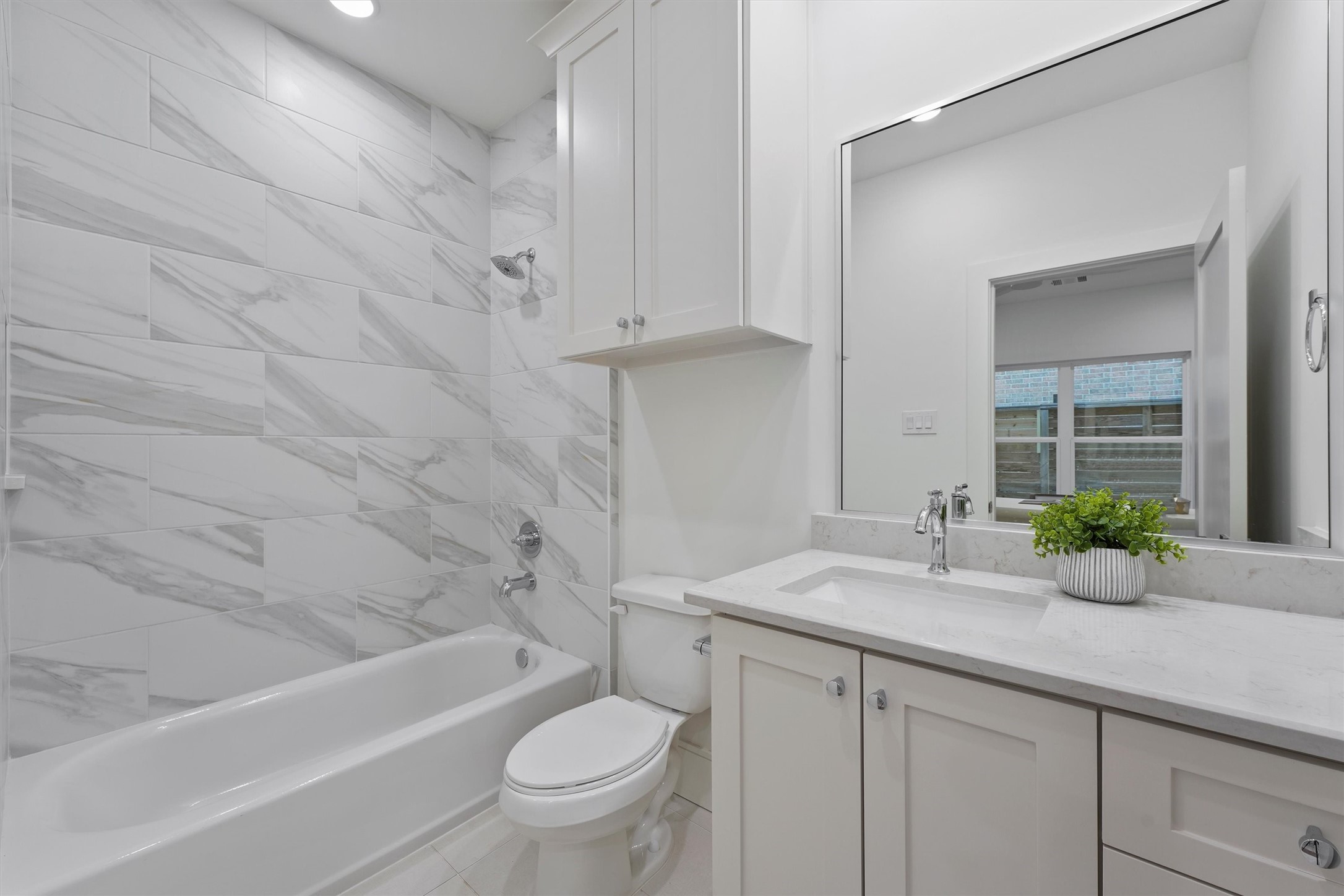 5407 Dickson Street Houston, TX 77007 - Photo 7 of 31 a bathroom with a granite countertop sink toilet and shower