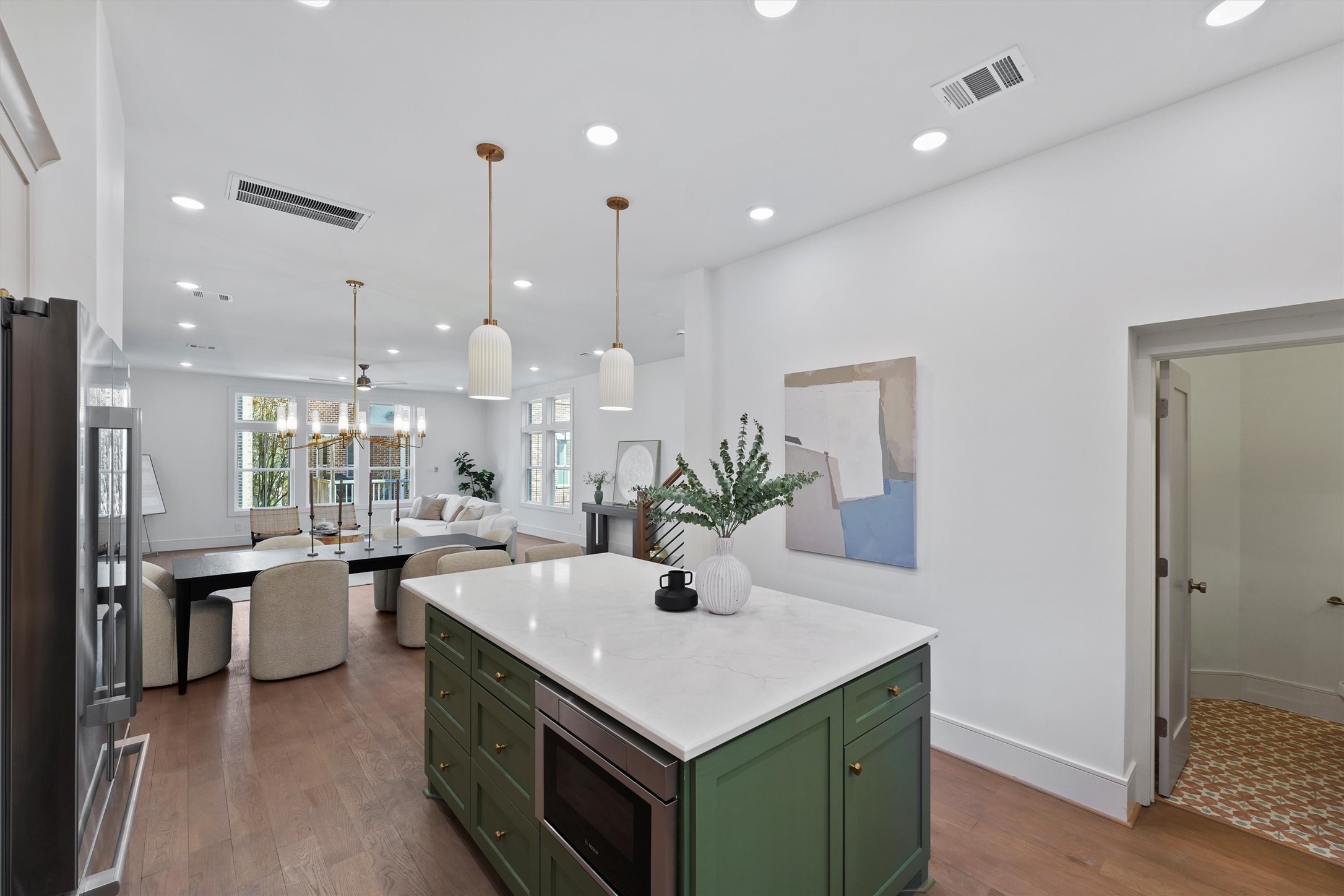 5407 Dickson Street Houston, TX 77007 - Photo 9 of 31 a kitchen with kitchen island a sink appliances and wooden floor