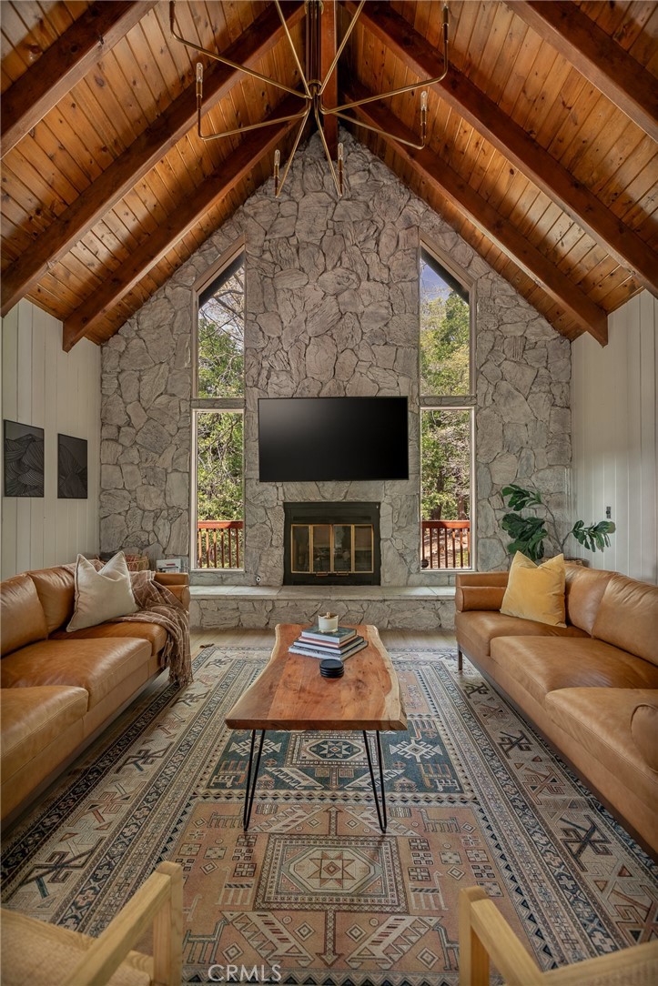 373 Summit Road Lake Arrowhead, CA 92352 - Photo 21 of 41 a living room with furniture and a flat screen tv