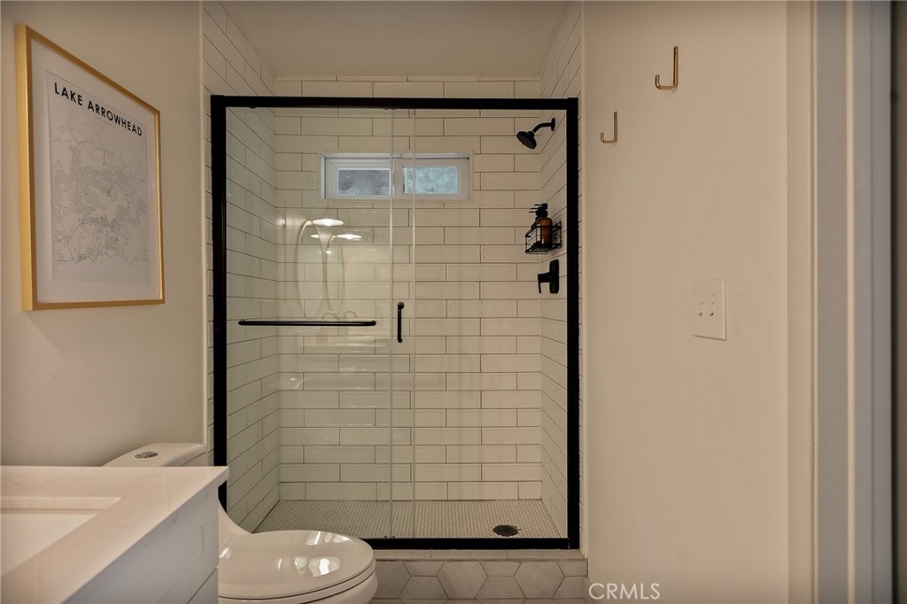 373 Summit Road Lake Arrowhead, CA 92352 - Photo 30 of 41 a bathroom with a shower and toilet