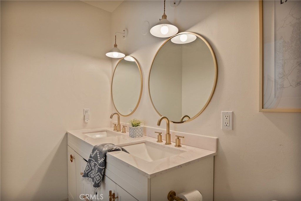 373 Summit Road Lake Arrowhead, CA 92352 - Photo 31 of 41 a bathroom with a sink and a mirror