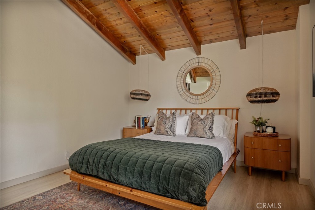 373 Summit Road Lake Arrowhead, CA 92352 - Photo 33 of 41 a bedroom with a bed and a table