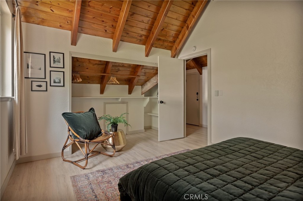 373 Summit Road Lake Arrowhead, CA 92352 - Photo 34 of 41 a bedroom with a bed and a chair