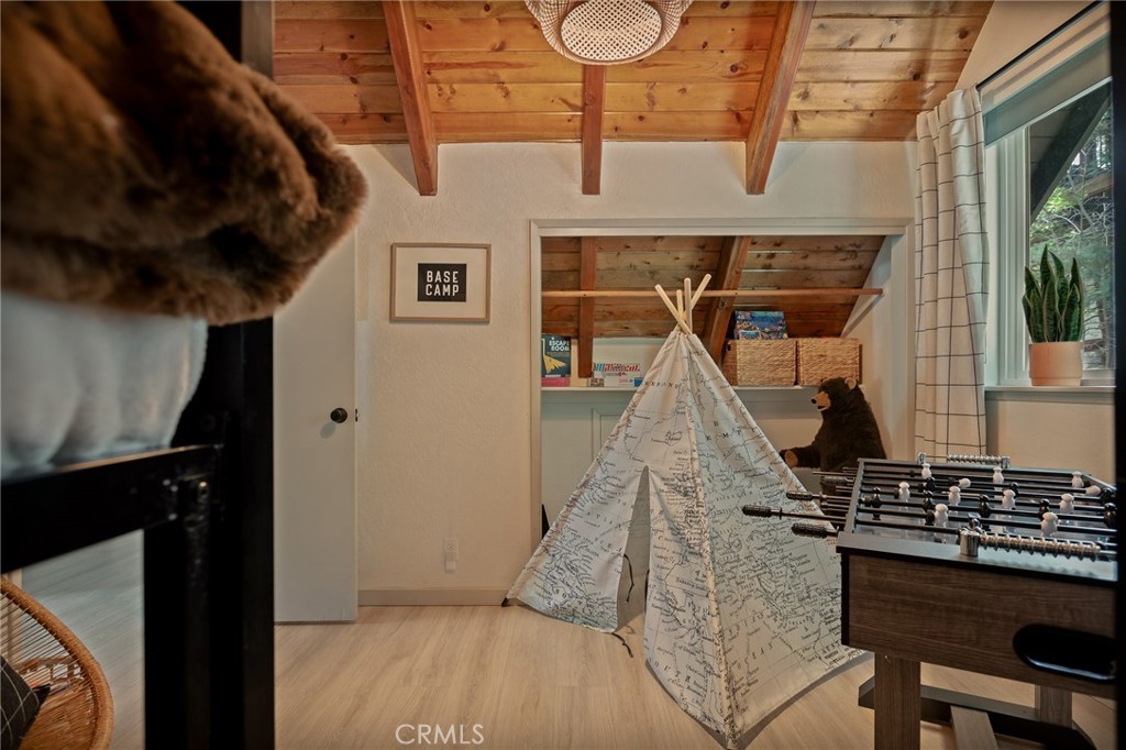 373 Summit Road Lake Arrowhead, CA 92352 - Photo 36 of 41 a view of a hall with wooden floor and a large window