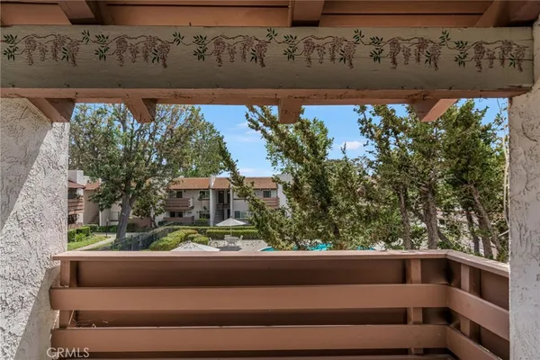 a view of balcony with furniture