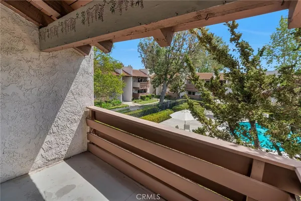 a small pool with outdoor seating and yard