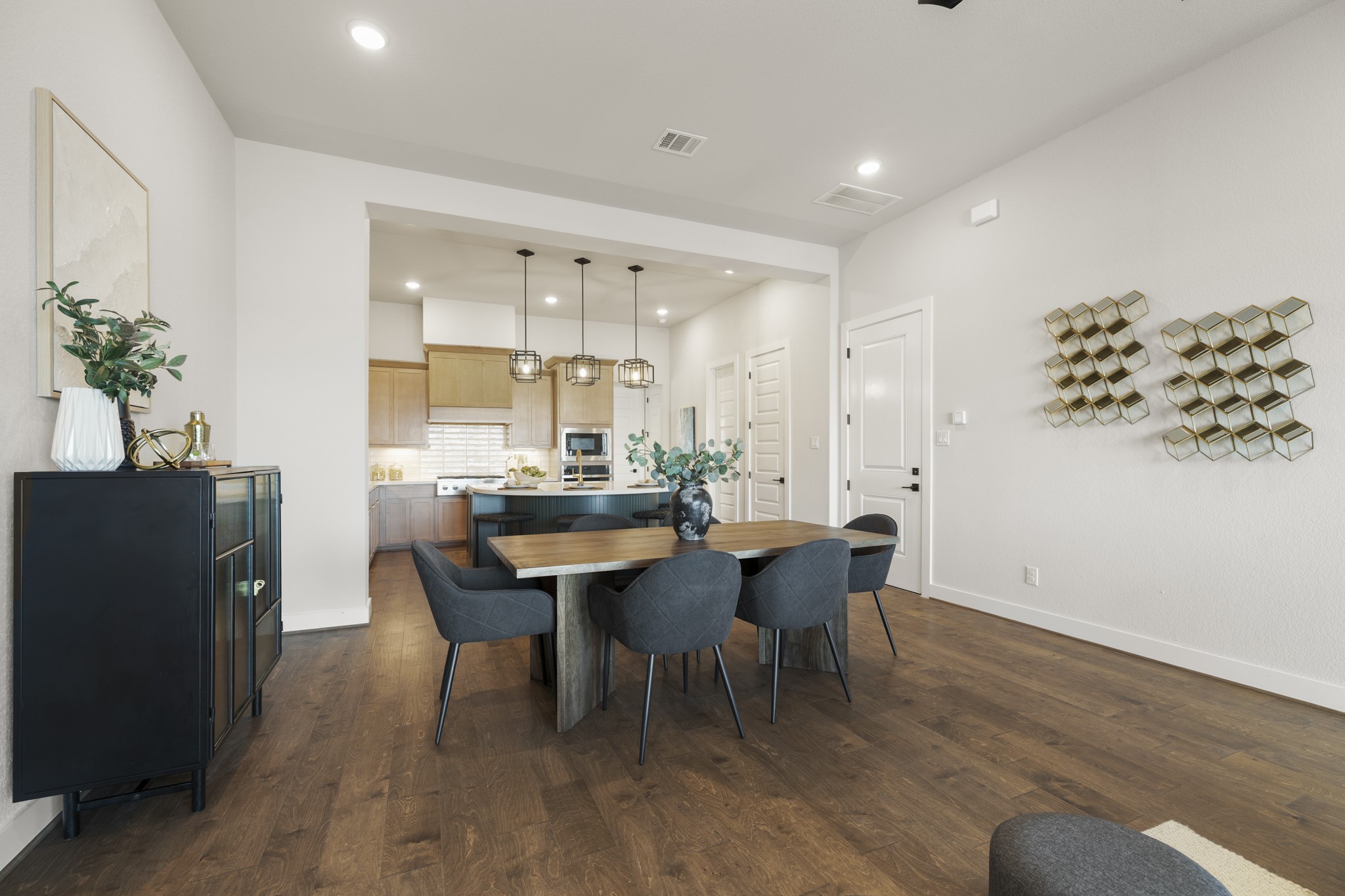 4412 Tucker Lane Seabrook, TX 77586 - Photo 12 of 41 a view of a dining room with furniture and wooden floor