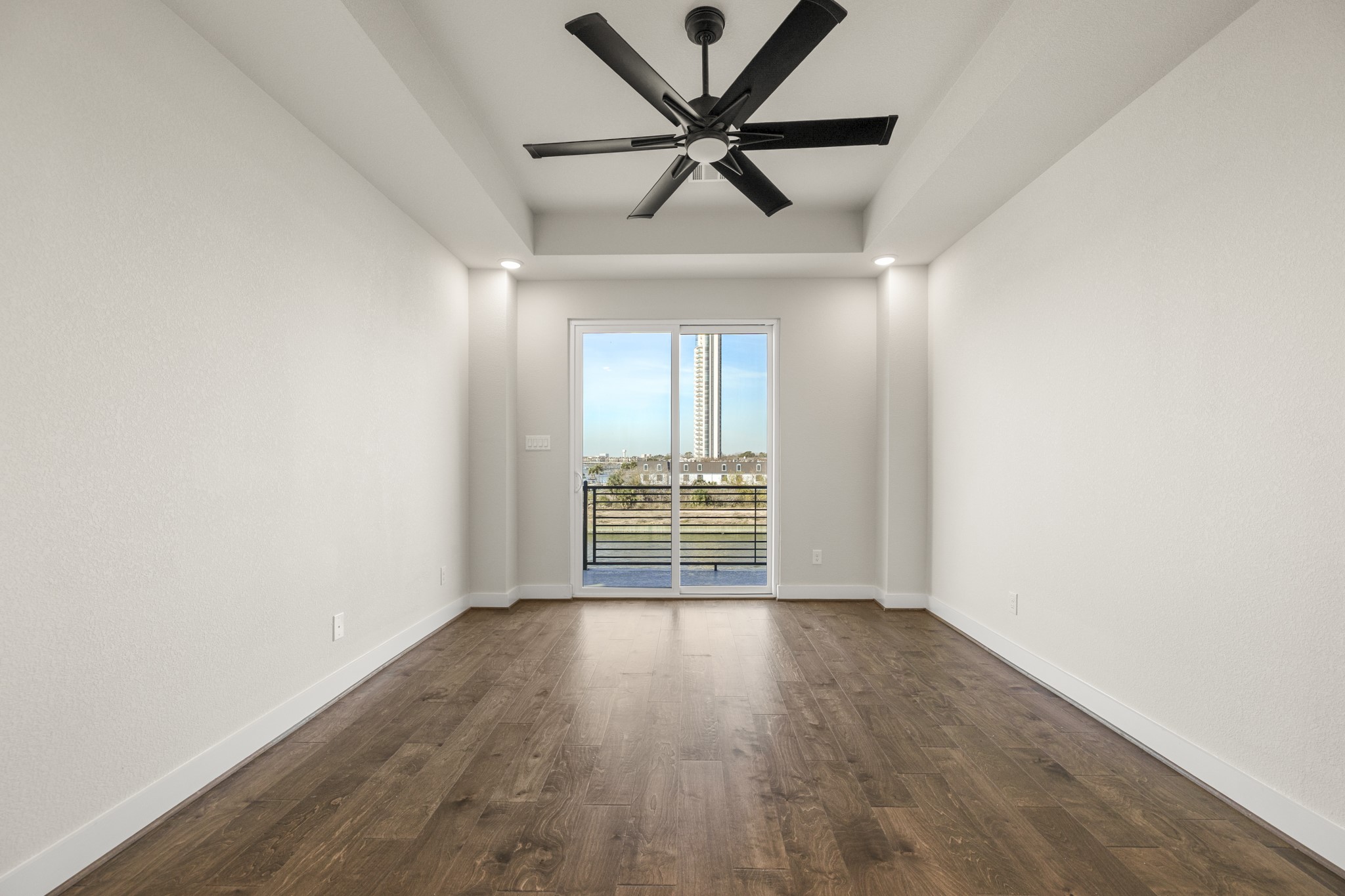 4412 Tucker Lane Seabrook, TX 77586 - Photo 13 of 41 an empty room with wooden floor and windows