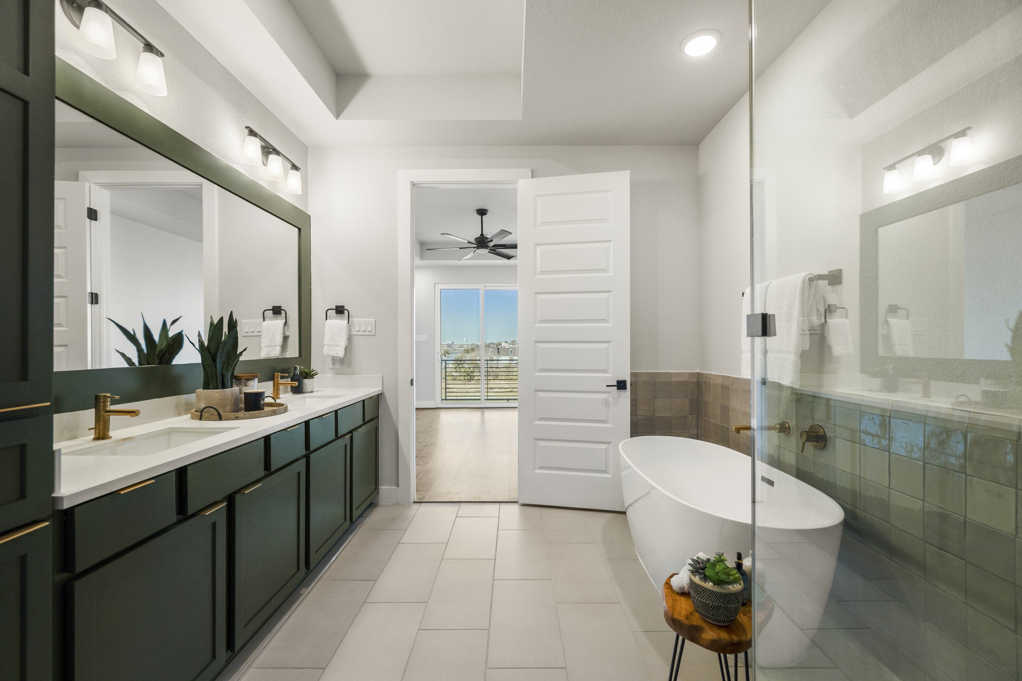 4412 Tucker Lane Seabrook, TX 77586 - Photo 16 of 41 a bathroom with a sink mirror and a bathtub