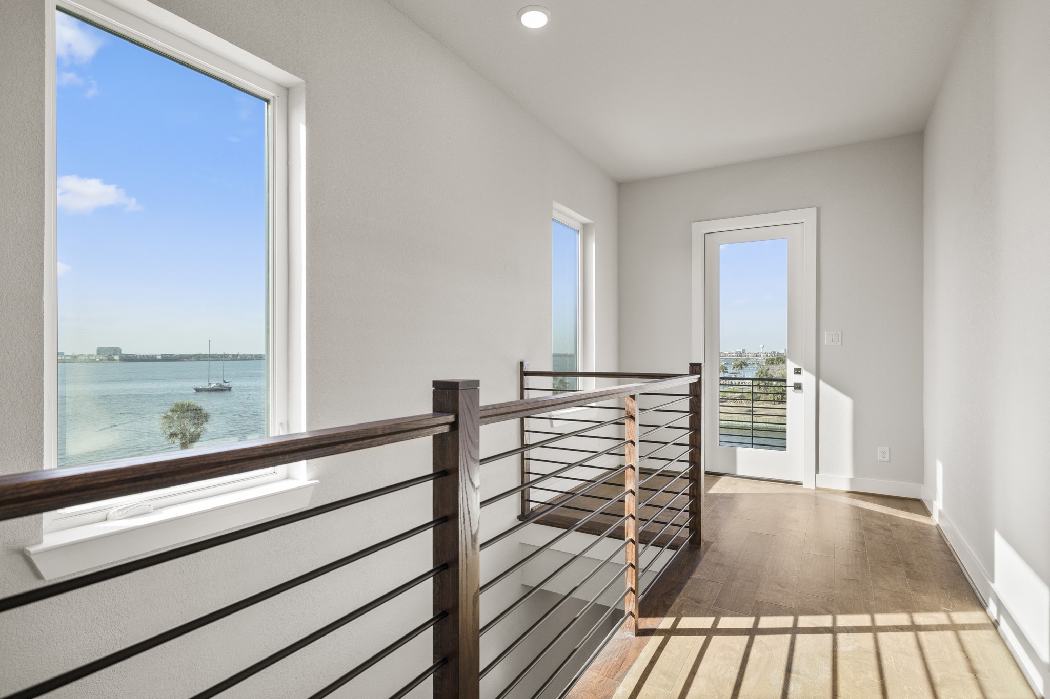 4412 Tucker Lane Seabrook, TX 77586 - Photo 22 of 41 a view of a balcony with wooden floor and iron floor